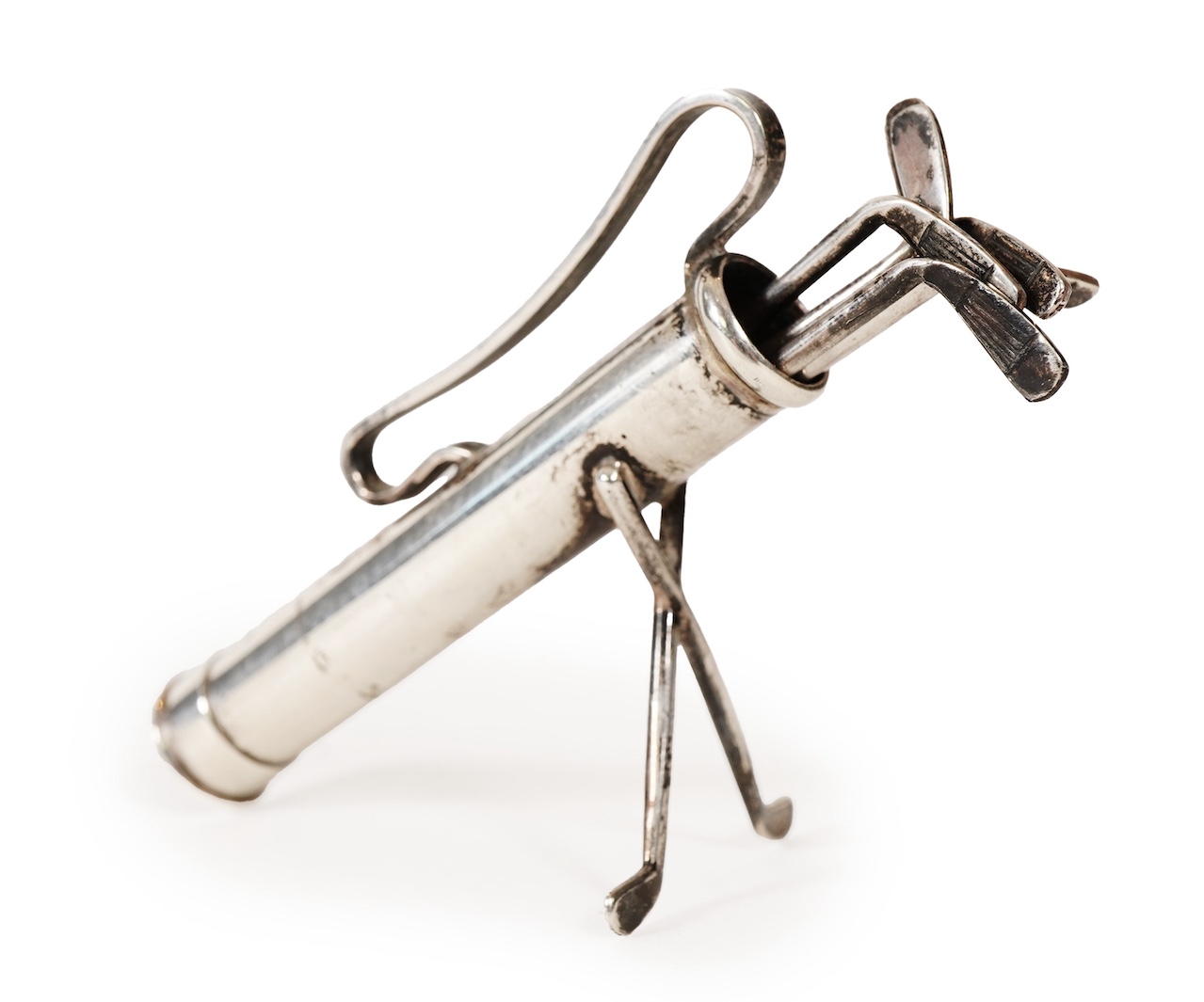 A set of six George V novelty silver cocktail sticks with holder, modelled as a golf bag with clubs, by John Nowill & Sons